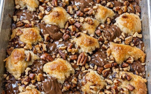 Toss unwrapped raw milk chocolate kisses in the sheet pan with 2 extra ingredients to bake a dessert so mouthwatering…